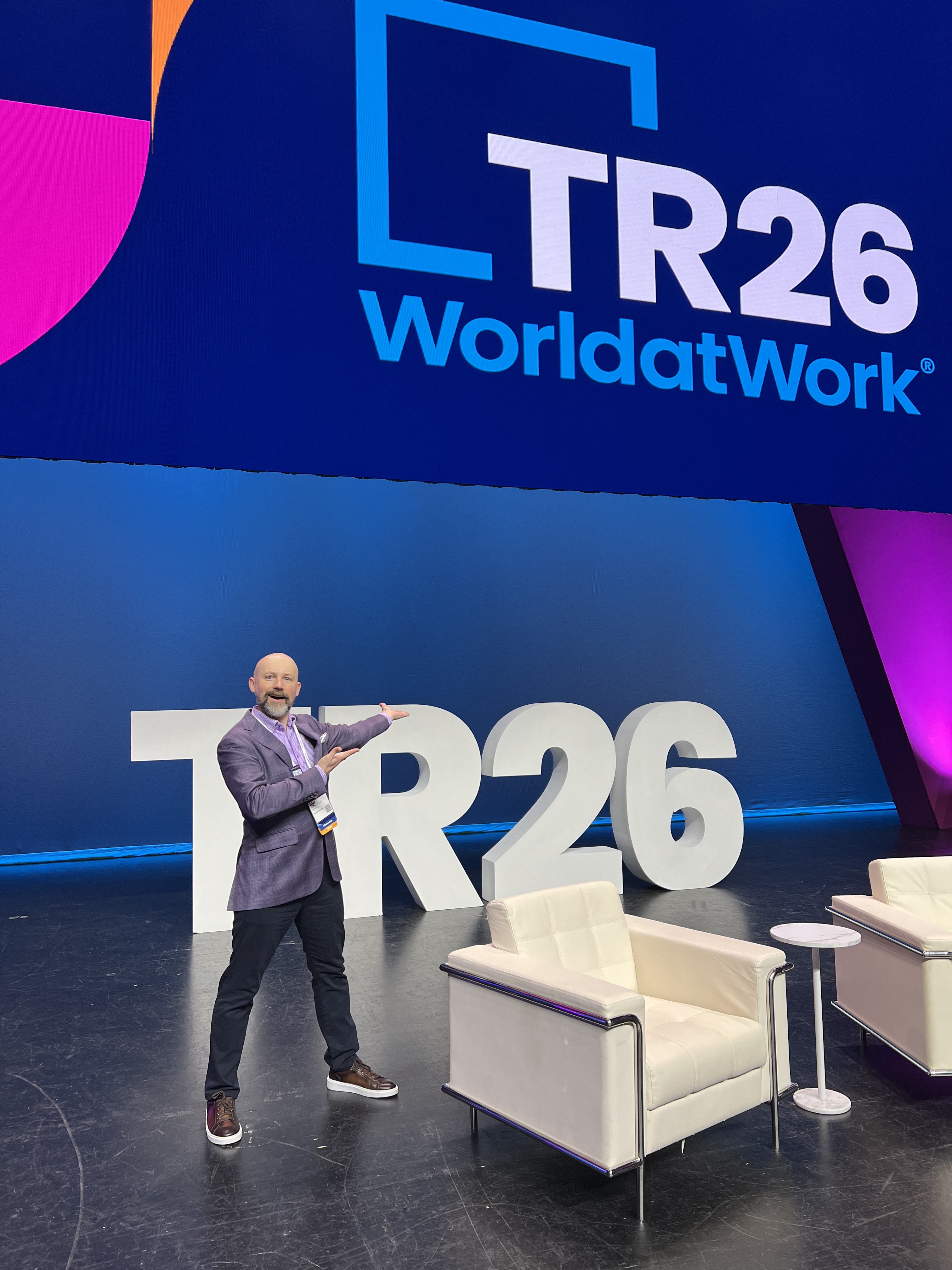 Ryan on the main stage at WorldatWork TR26